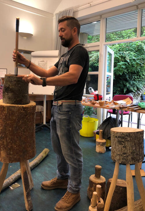 classroom nick demonstrates splitting a round log techniques using an axe and mallet